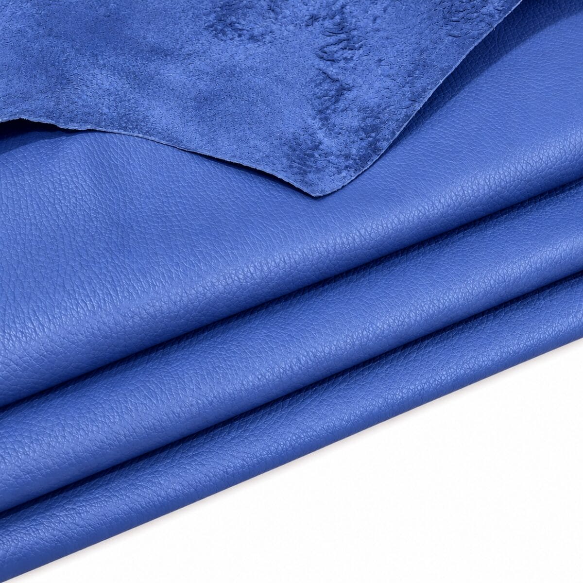 Baja Blue Pebble Lambskin Leather Floater detail Baja Blue pebble lambskin leather hides layered, showing the grain and suede edge
