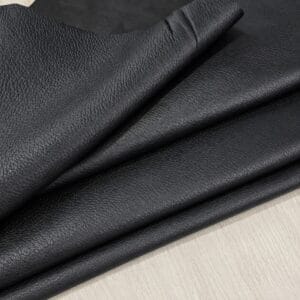 Black Pebble Lambskin Leather Floater folded Black pebble lambskin leather folded, showing the grain side and suede back