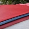 SL-115 stretch lamb Red and navy blue SL-115 Stretch Lamb leather hides displayed together with smooth grain texture.