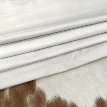 White pig leather hides folded in layers – tannery run half bundle