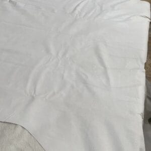 White full grain pig leather hide laid flat, tannery run grade White full grain pig leather hide laid flat, tannery run grade